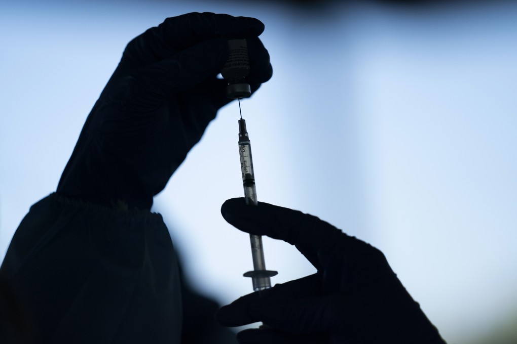 A health worker prepares the Pfizer-BioNTech Covid-19 vaccine at a clinic in California. Photo: AP