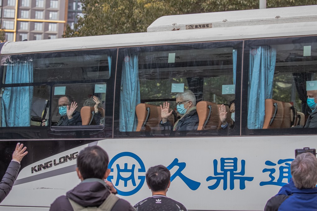 WHO experts leave the Jade Boutique Hotel in Wuhan by bus on Thursday after spending 14 days in quarantine. Photo: EPA-EFE