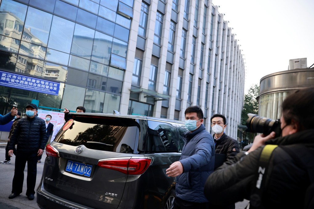 A car carrying members of the World Health Organization team arrives at Hubei Provincial Hospital in Wuhan on Friday. Photo: Reuters