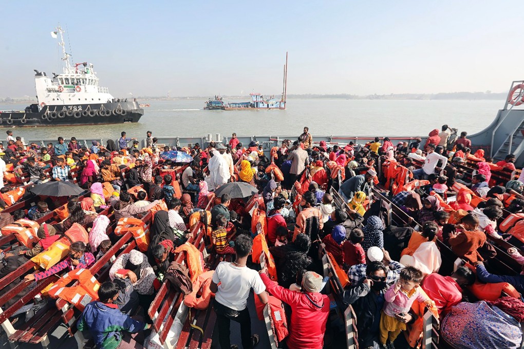 Rohingya refugees sit on board a naval ship taking them to Bangladesh’s Bhashan Char Island. Photo: EPA-EFE