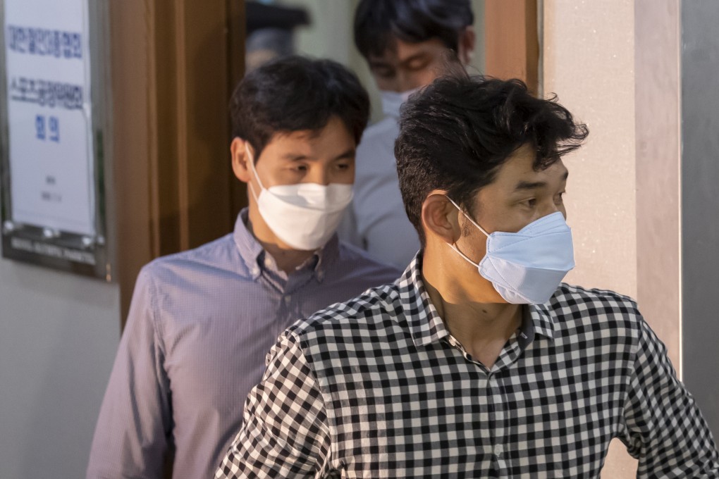 Kim Gyu-bong (right), the former head coach of the triathlon team at semi-pro club Gyeongju City Hall, has been sentenced to seven years in prison. Photo: EPA