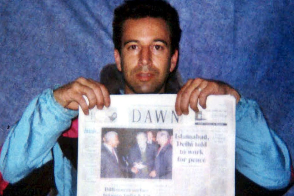 US reporter Daniel Pearl is seen at an undisclosed location with a copy of Pakistan's English language newspaper Dawn. Photo: The Washington Post via AFP