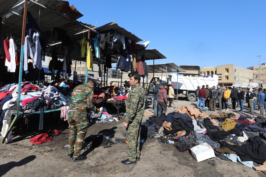 Iraqi security forces are seen at the site of an explosion in a Baghdad used clothes market on January 21. Photo: EPA-EFE
