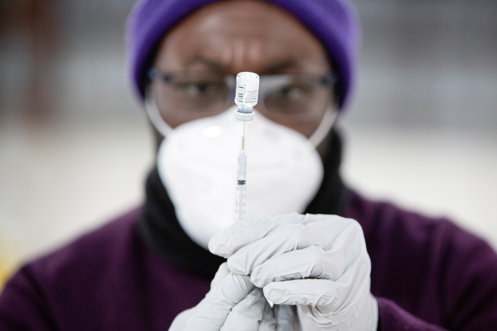 A pharmacy manager draws up a Covid-19 vaccine at a mass vaccination site in Washington state, US, as new variants threaten the efficacy of existing jabs. Photo: Reuters