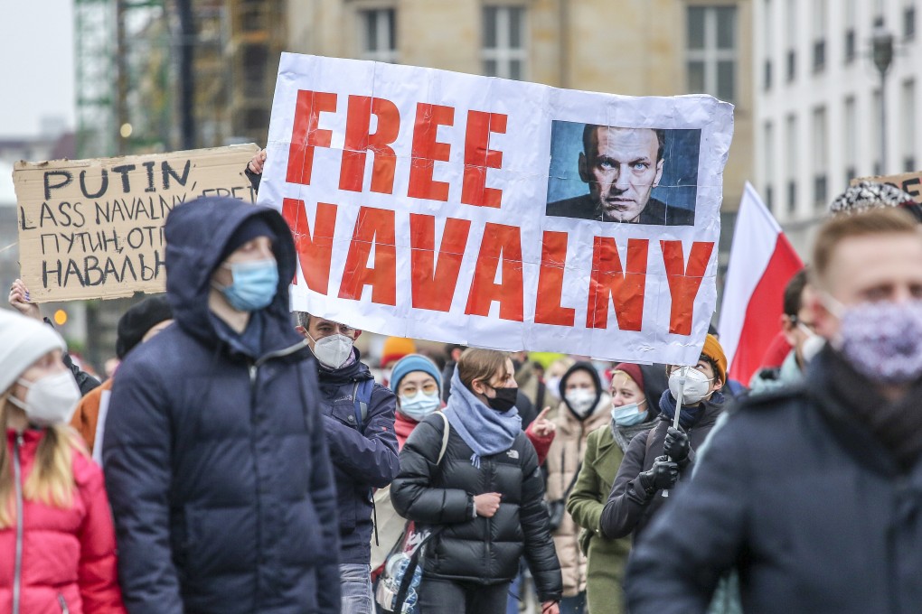 Protesters in Berlin hold a banner reading “Free Navalny” on January 23. Berlin is home to a large expatriate Russian community. Photo: Getty Images Europe / TNS