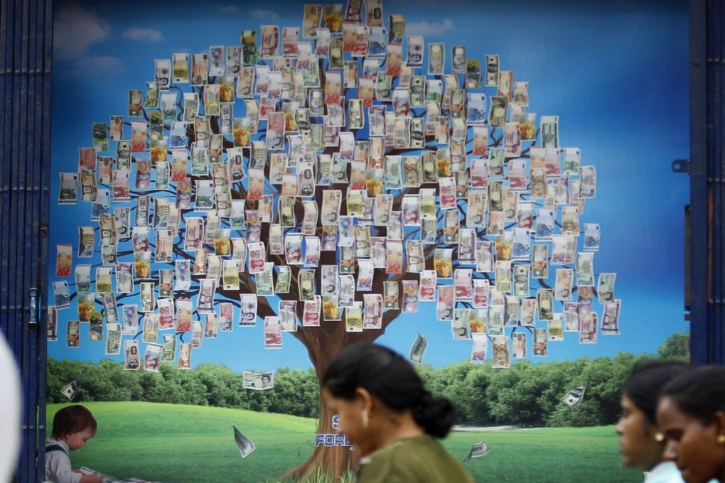 A picture of a money tree outside a currency exchange shop in Bangalore, India, in 2013. Photo: AP
