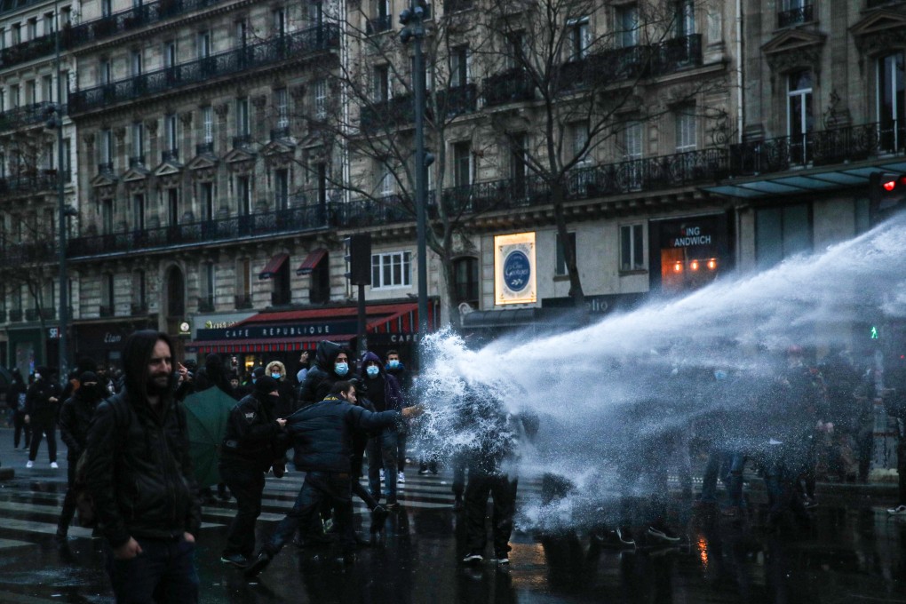 Police uses a water cannon against protesters as they clash during a demonstration in Republique square, Paris, France on Saturday. Photo: EPA-EFE