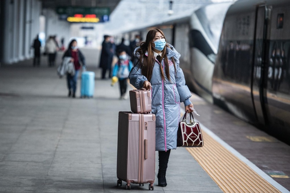 Very few passengers wait to board trains at a station in southwest China’s Guizhou province on Thursday as the world’s largest annual human migration begins with considerably fewer trips expected. Photo: Xinhua