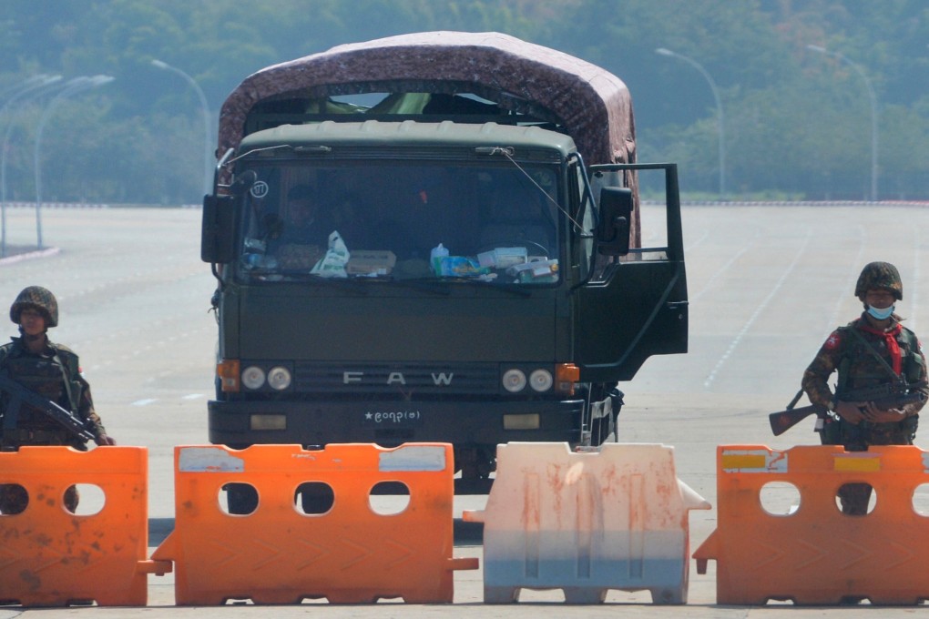 Soldiers block the road heading to Myanmar’s parliament in Naypyidaw on Monday. Photo: AFP