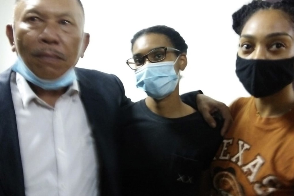 American graphic designer Kristen Gray, centre, her partner Saundra Michelle Alexander, right, and lawyer Erwin Siregar, arrive for questioning in Denpasar, Bali. Photo: AP