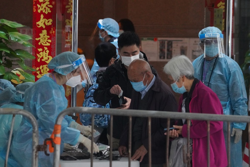 Residents of Laguna City in Lam Tin are cleared by health officials before being allowed to leave the lockdown area on Monday. Photo: Winson Wong
