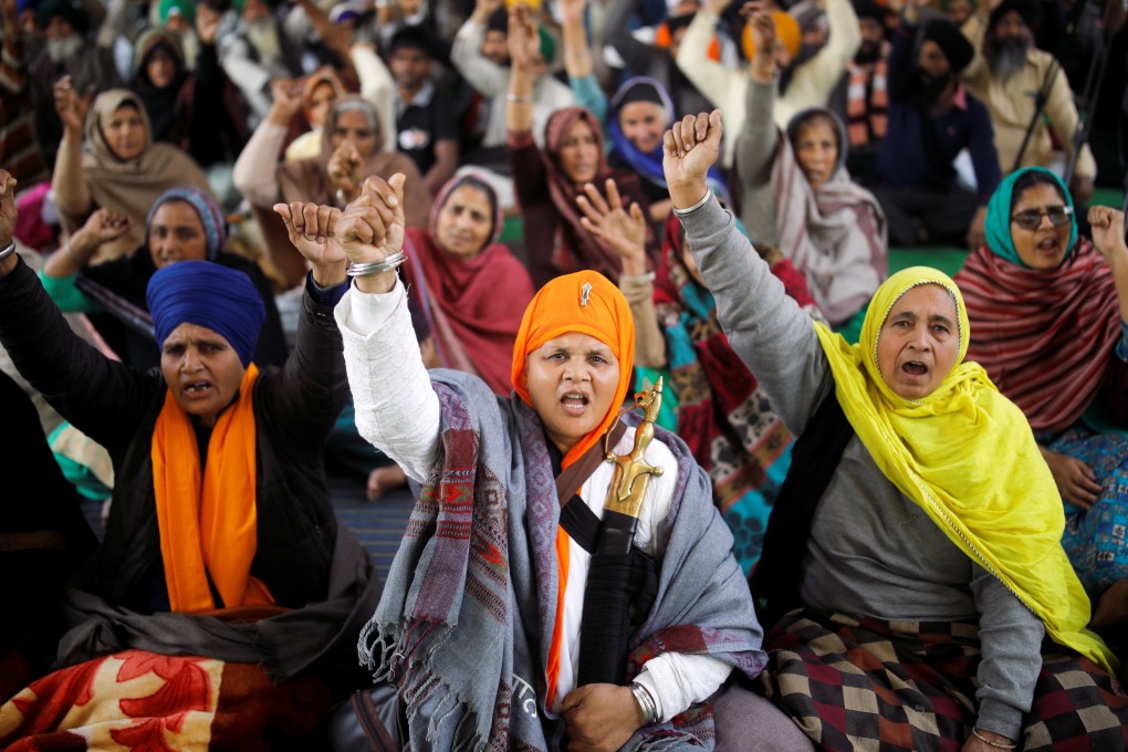 Farmers shout slogans at a site of a protest near New Delhi on Saturday. Photo: Reuters