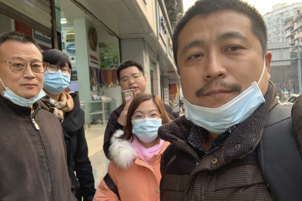 Ren Quanniu (right) with supporters. Photo: AP