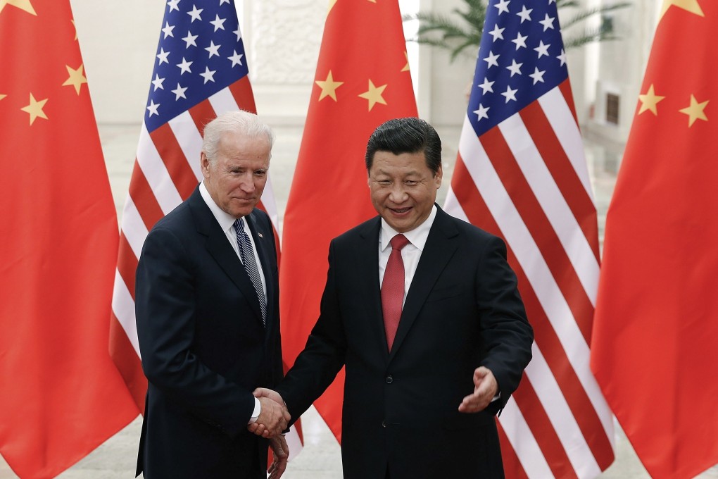 Chinese President Xi Jinping, right, shakes hands with then US vice-president Joe Biden in 2013 in Beijing. Photo: AP