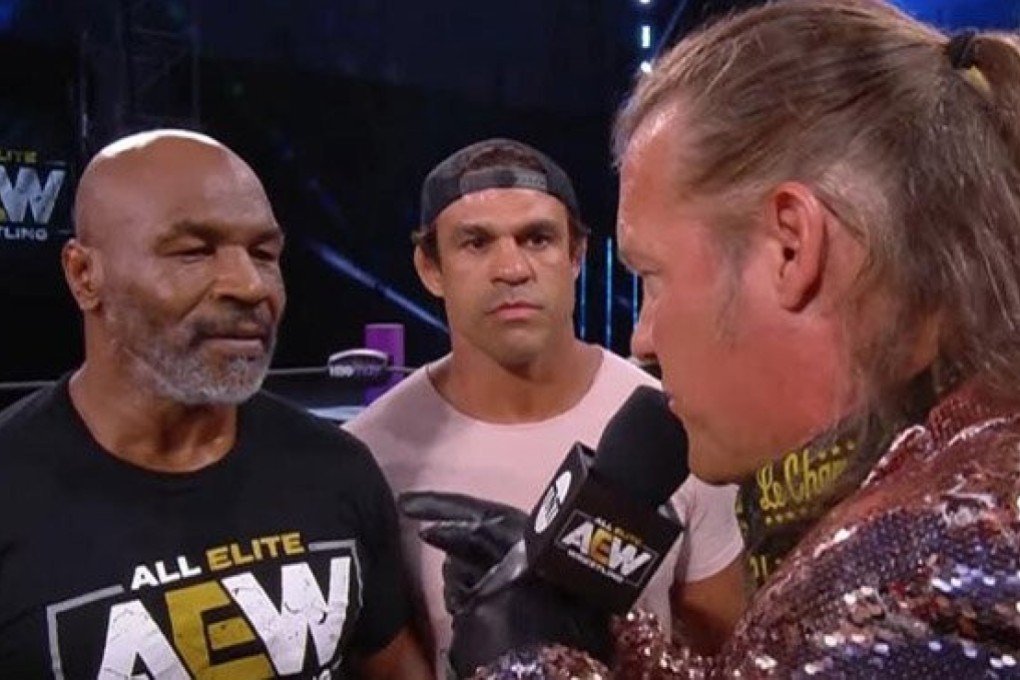 Mike Tyson, backed up by Vitor Belfort (centre), confronts Chris Jericho (right) on AEW Dynamite. Photo: AEW
