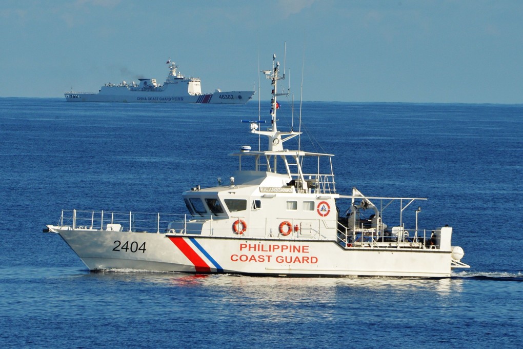 Chinese and Philippine coastguard vessels in the South China Sea. Photo: AFP