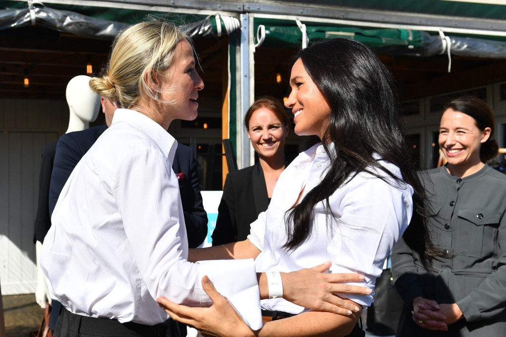 Meghan Markle (right), the Duchess of Sussex, embraces designer Misha Nonoo as the pair launch the Smart Works capsule collection on September 12, 2019 in London, England. Photo: Getty Images