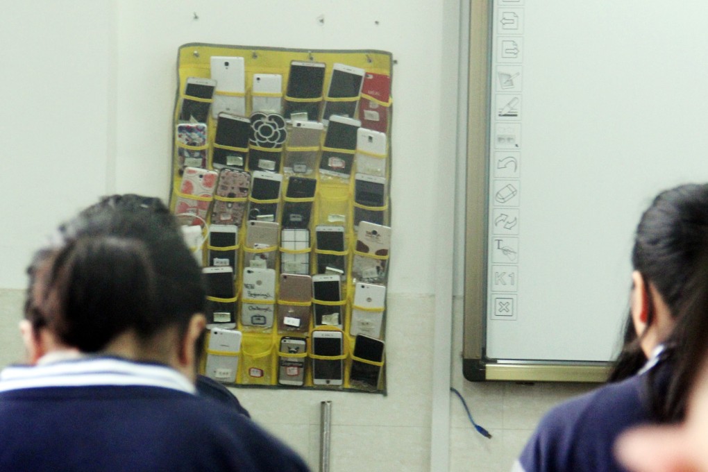 Some schools in China had already banned the use of mobile phones in class, such as a vocational school in Hangzhou, eastern China, where a rack to store students' mobile phones hangs next to the blackboard. Mobile phones have been banned from the country’s primary and secondary schools. Photo: Getty Images