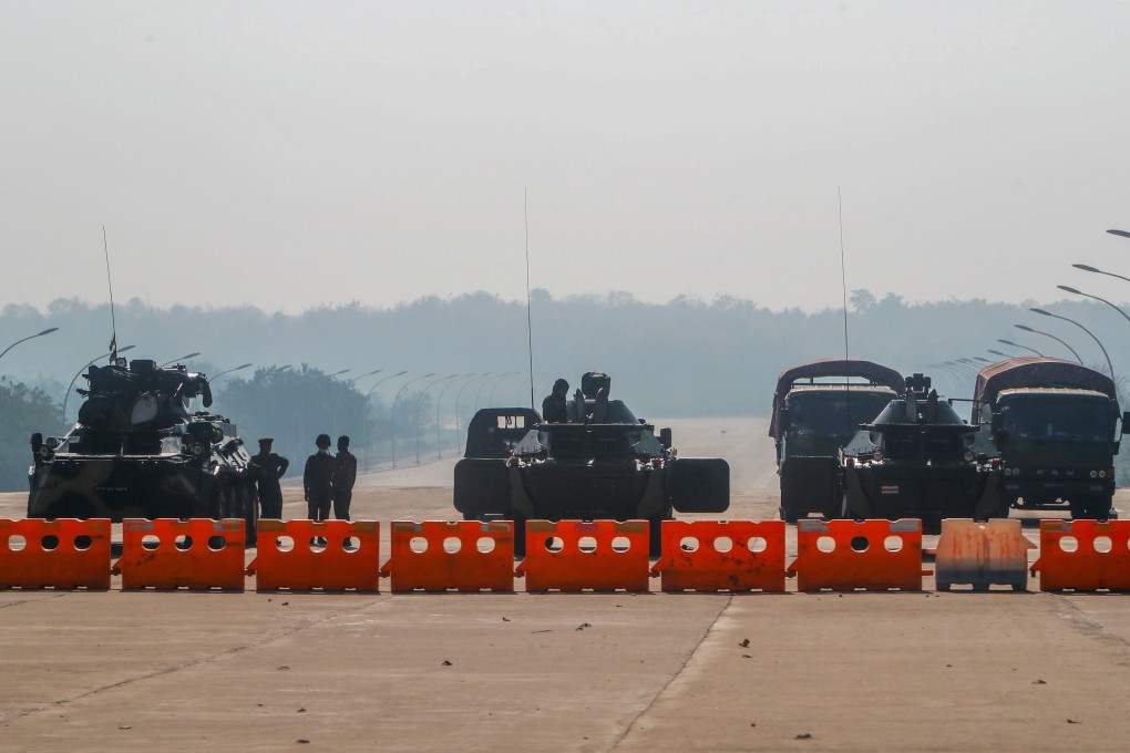 Military personnel stand guard at a checkpoint in Naypyitaw on Tuesday. Photo: AP