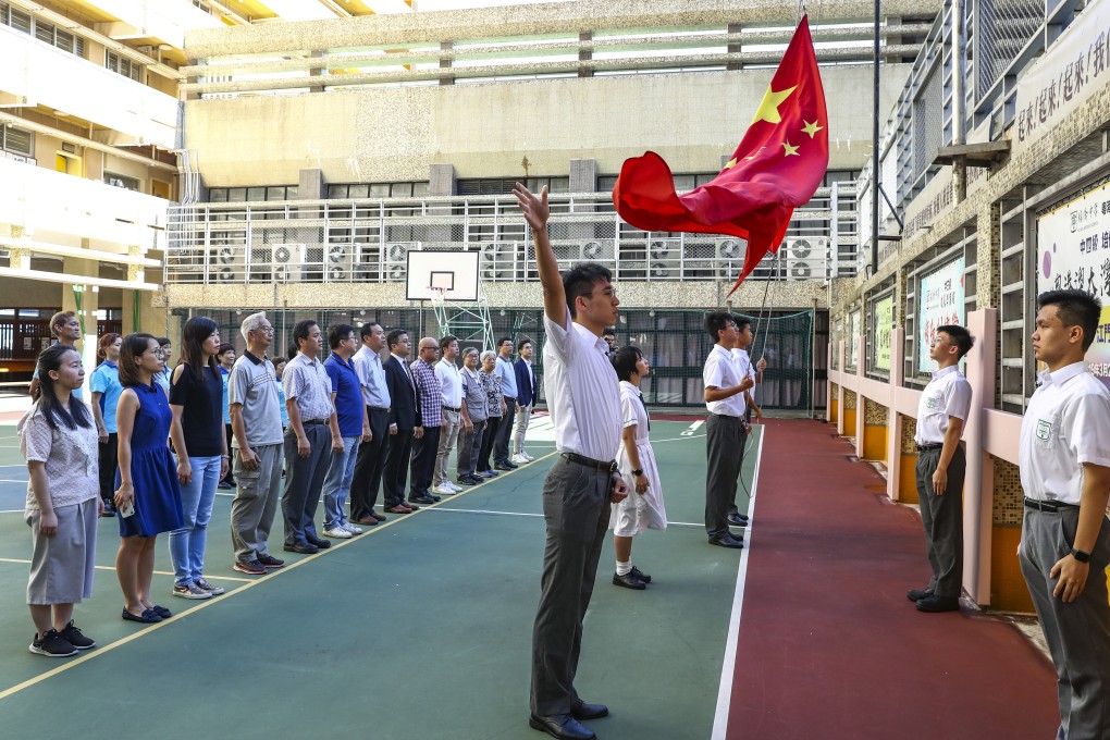 A flag-raising ceremony at Pui Kiu Middle School in North Point. Photo: Nora Tam