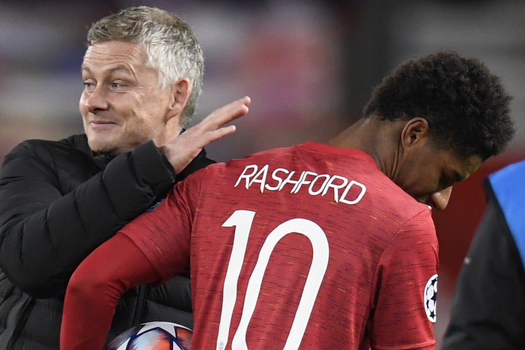 Manchester United forward Marcus Rashford gets a pat on the back by Ole Gunnar Solskjaer after their 5-0 victory in the Uefa Champions League against RB Leipzig in Manchester in October 2020. Photo: EPA