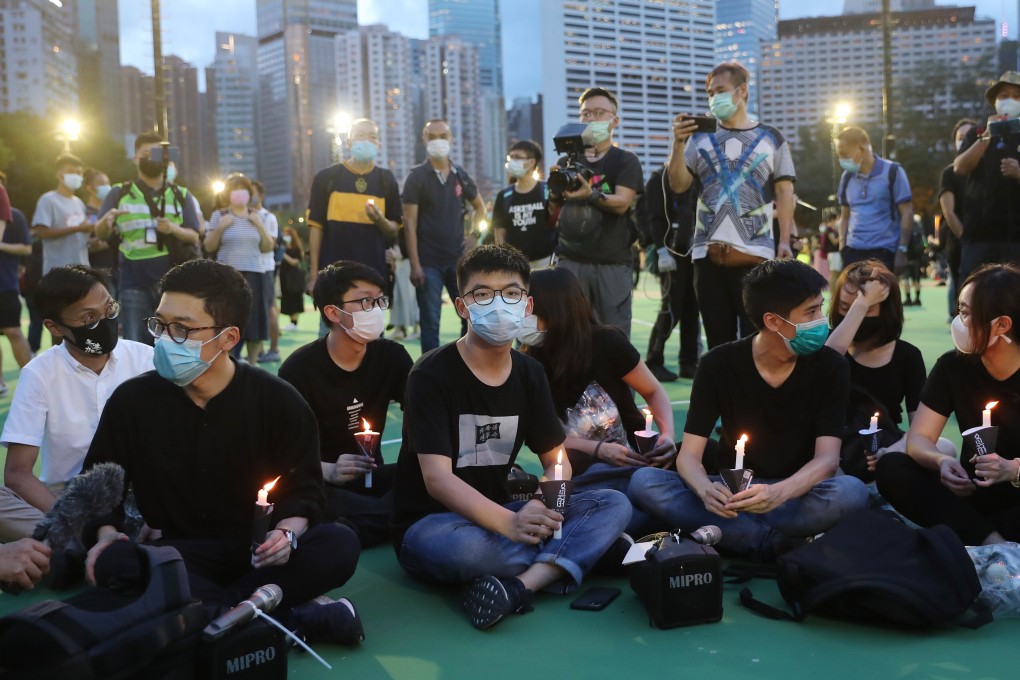Joshua Wong (centre) takes part in a June 4 vigil in Victoria Park. Photo: Sam Tsang