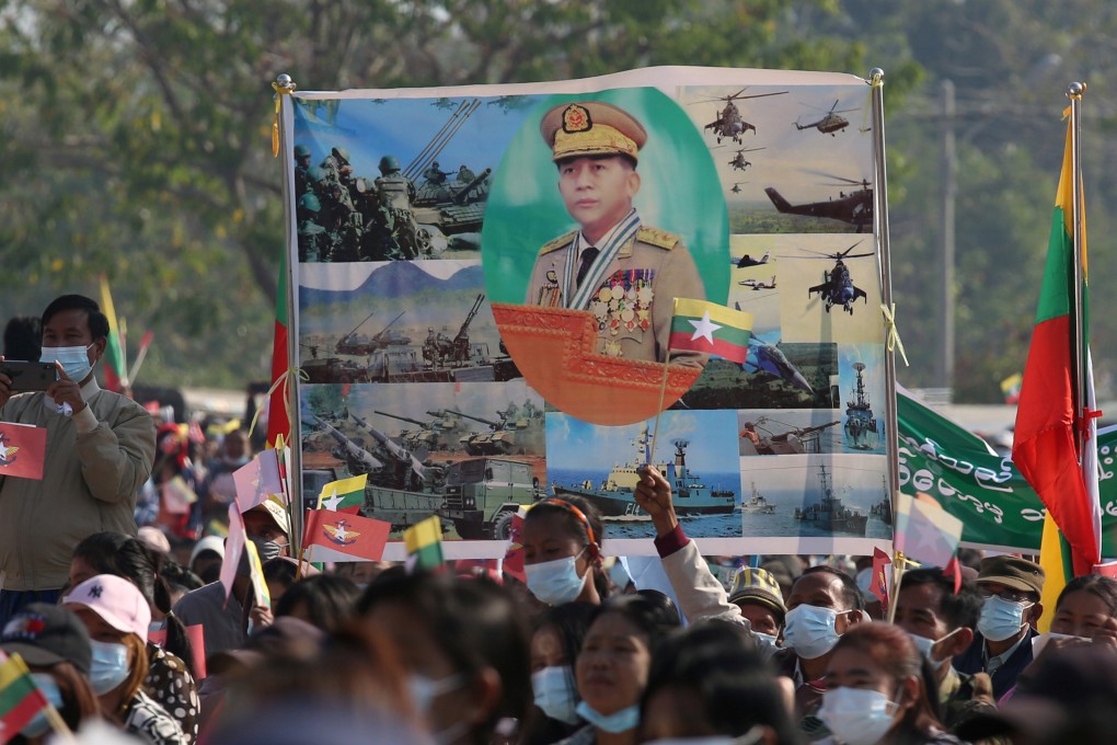 Supporters of Myanmar’s military carry a portrait of junta leader General Min Aung Hlaing as they celebrate the coup in Naypyitaw. Photo: Reuters