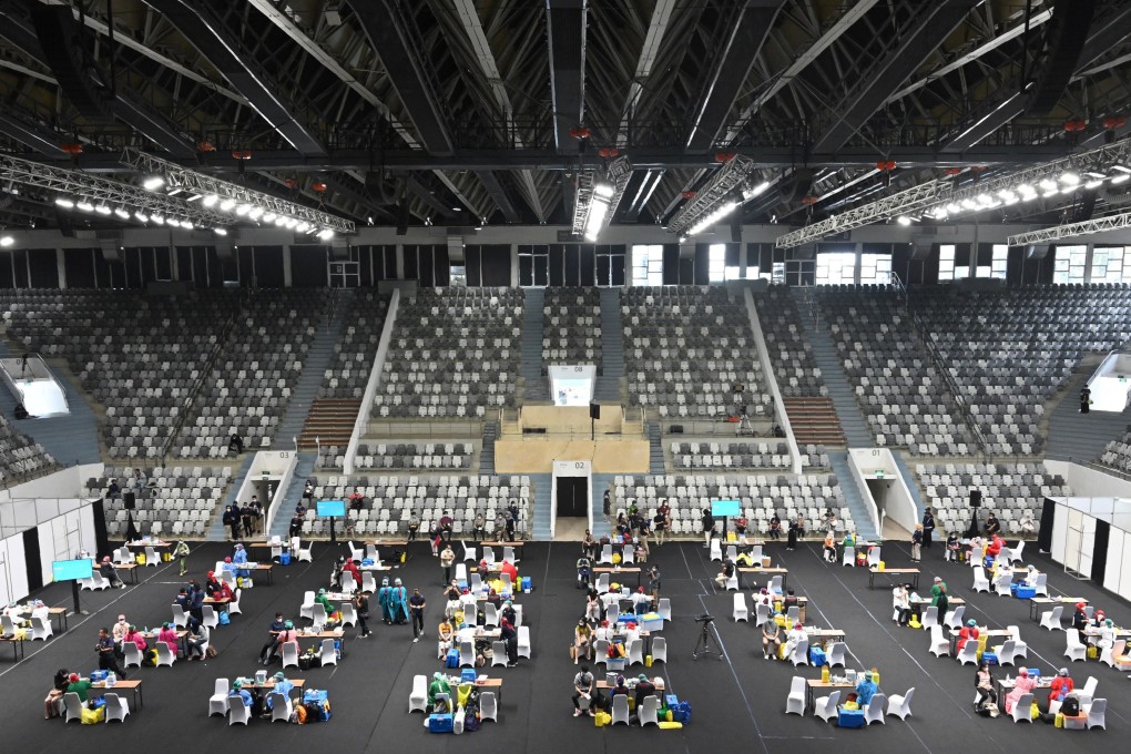 Health workers conduct a mass vaccination for the Covid-19 coronavirus at Senayan stadium in Jakarta on Thursday. Photo: AFP