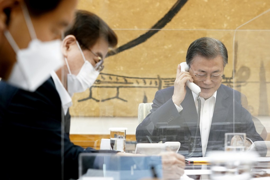 South Korean President Moon Jae-in (right) talks with his US counterpart Joe Biden over the phone. The two leaders agreed to upgrade the bilateral alliance. Photo: YNA/DPA