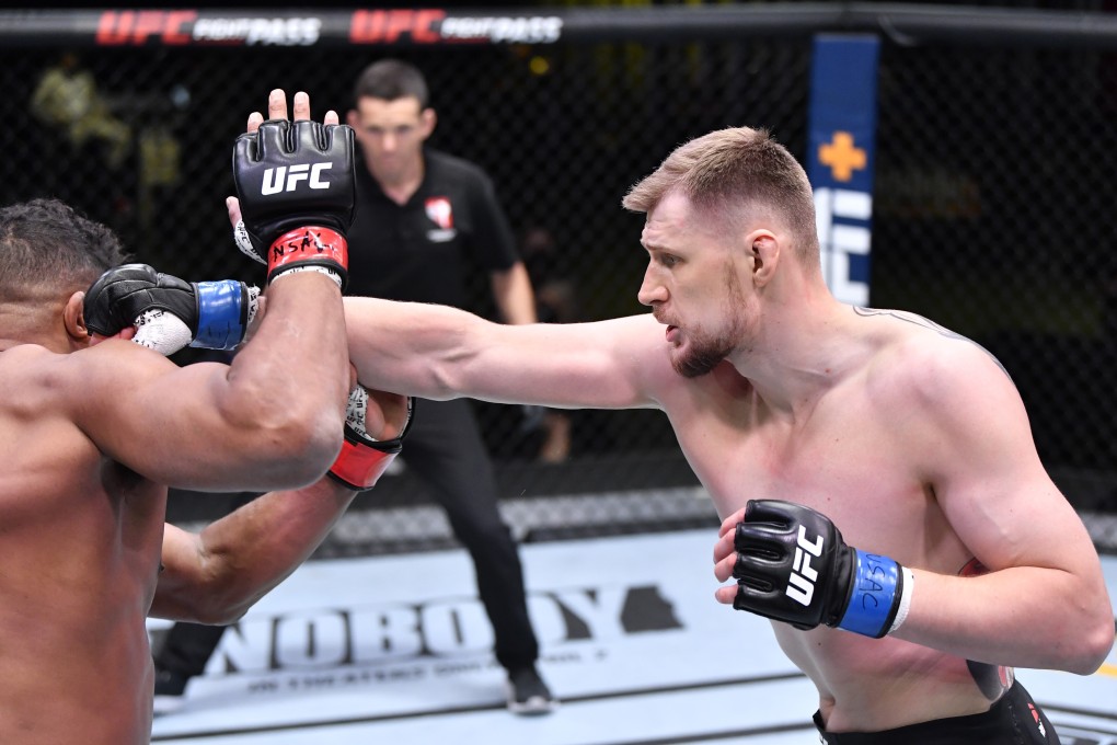 Russian Alexander Volkov punches Alistair Overeem in their heavyweight fight during the UFC Fight Night event at UFC APEX in Las Vegas. Photo: Chris Unger/Zuffa LLC