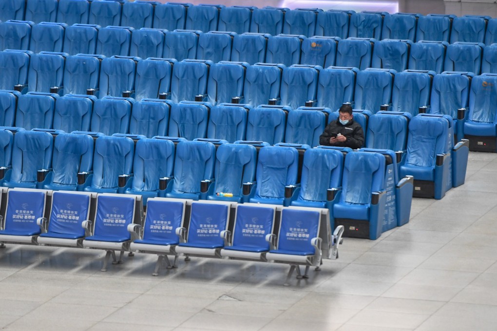 A passenger waits for a train at Changchun railway station, in Jilin province, on January 28. Photo: Xinhua