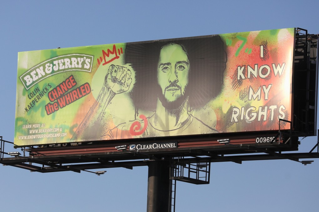 A Ben and Jerry’s advertisement featuring Colin Kaepernick is put up near Raymond James Stadium ahead of Super Bowl LV. Photo: Reuters