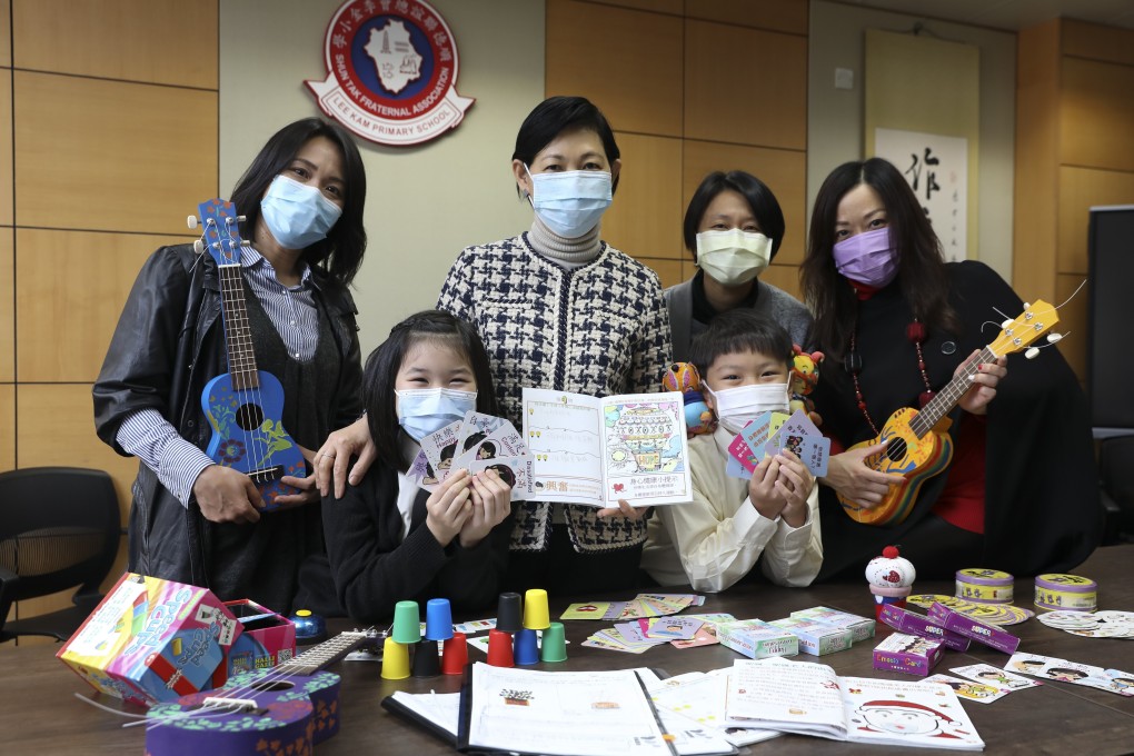 (Back row, left to right) STFA Lee Kam Primary School teacher Chan Wing-Yan, principal So Bik-ting, teacher Ho Wan-yin, and vice-principal Ip Bik-Kwan along with two students in the ‘positive education’ module. Photo: K. Y. Cheng