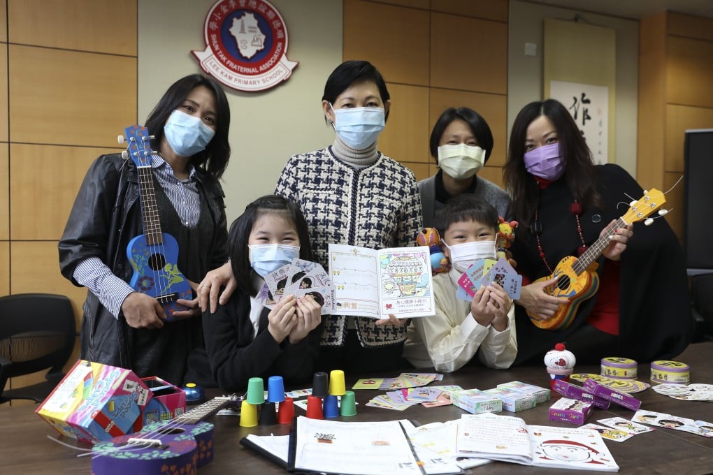 (Back row, left to right) STFA Lee Kam Primary School teacher Chan Wing-Yan, principal So Bik-ting, teacher Ho Wan-yin, and vice-principal Ip Bik-Kwan along with two students in the ‘positive education’ module. Photo: K. Y. Cheng