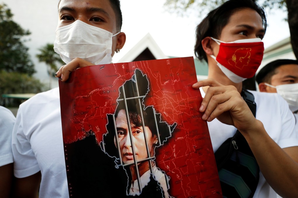 Protesters in Myanmar with a picture of Aung San Suu Kyi after the military seized power in a coup. Photo: Reuters