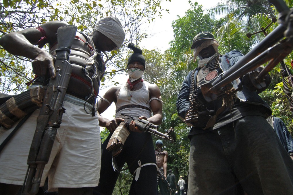 Masked gunmen pictured in Nigeria’s oil-rich Rivers State in 2007. Kidnapping for ransom used to be common in Nigeria’s oil-producing south but has lately spread to the other parts of the country. Photo: AFP