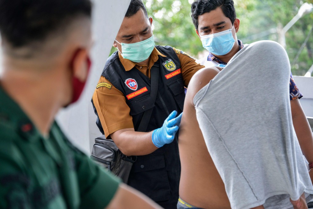 Medical workers treat a Christian man’s wounds after he was flogged for gambling in Banda Aceh. Photo: AFP