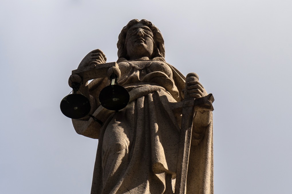 The Lady Justice statue atop the Court of Final Appeal in Hong Kong. Photo: Bloomberg