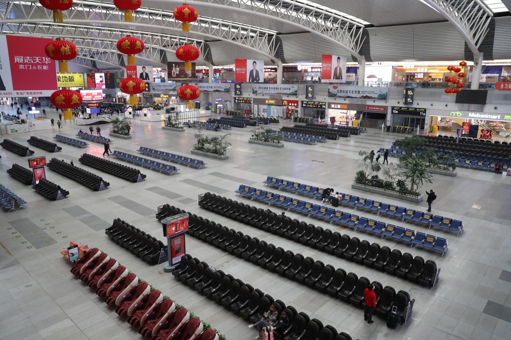 A railway station in Shenyang, northeastern China, is decorated for the Lunar New Year but the usual crowds of travellers returning home for the festival are absent. Photo: Xinhua