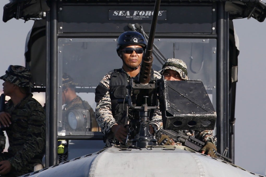 Members of Philippine Navy on patrol in Manila Bay. Photo: Reuters
