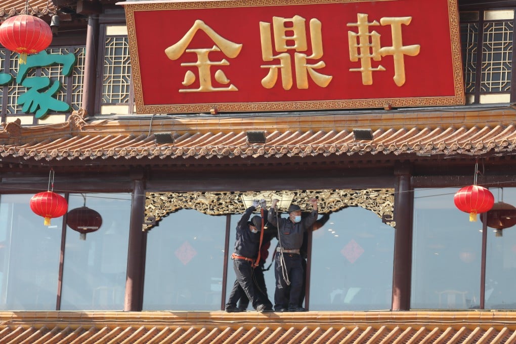 Lunar New Year decorations go up at a restaurant in Beijing. Monetary data released on Tuesday shows a surge in new credit last month, suggesting conditions remained supportive of growth momentum beyond the holiday. Photo: Simon Song