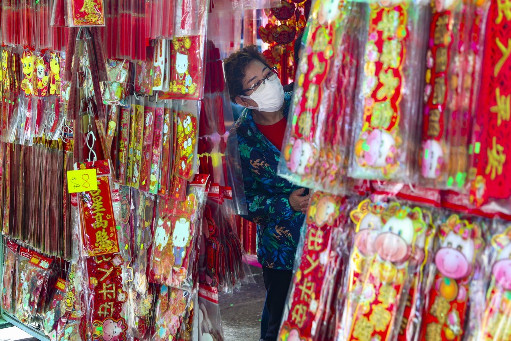 A woman shops for Lunar New Year decorations in Mong Kok. Photo: Edmond So