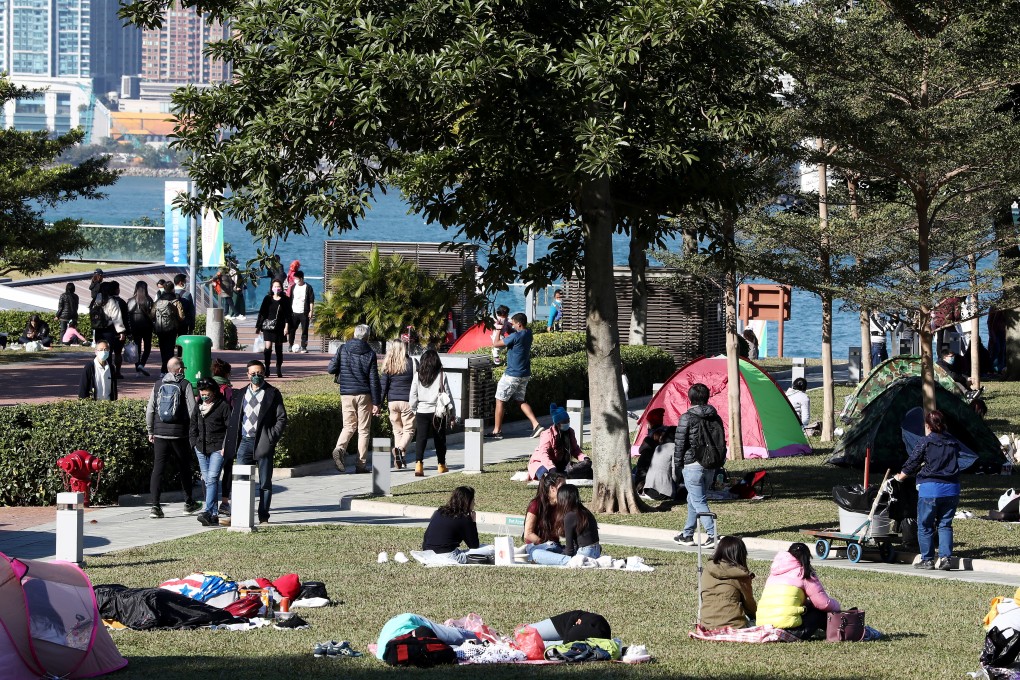 People enjoy a sunny day at Tamar Park, Admiralty, on January 21. Photo: Jonathan Wong