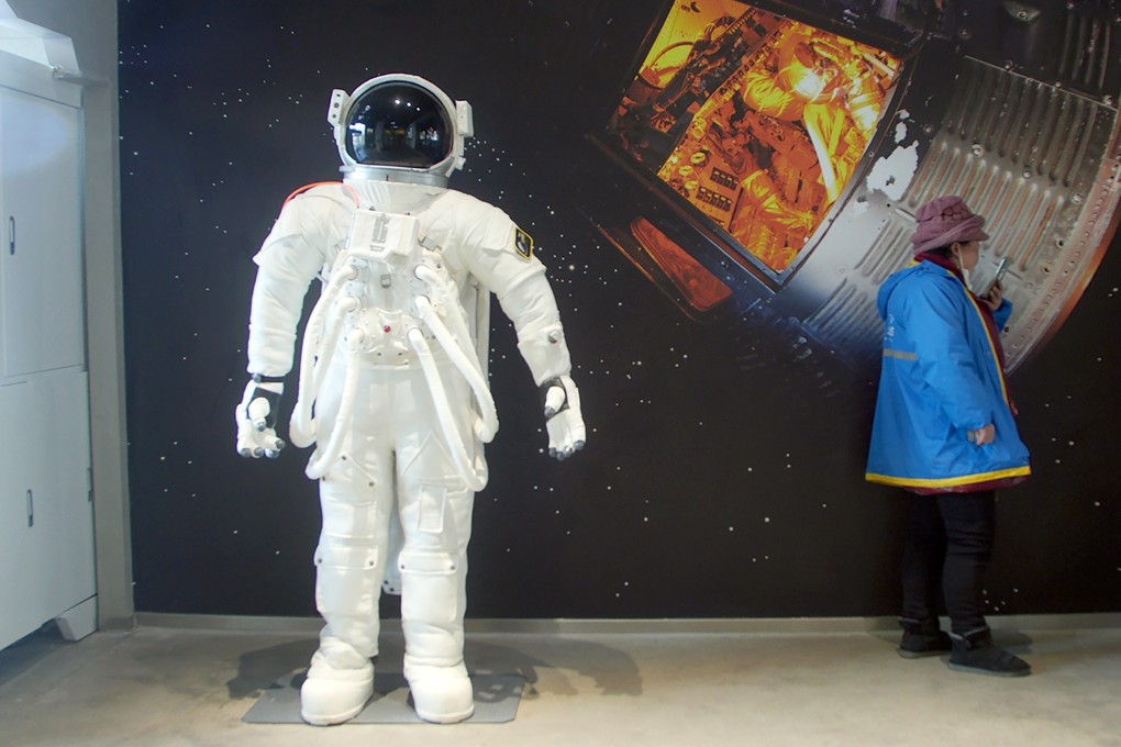 A delivery driver waits for an order at a themed cafe in Beijing, as China’s ambitious missions add to people’s interest in space. Photo: AP