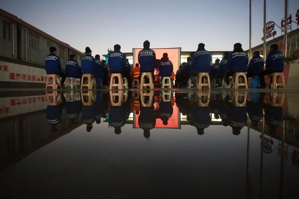 Migrant workers have been discouraged from travelling during upcoming Lunar New Year celebrations, with some employers providing entertainment including free outdoor films. Photo: AFP