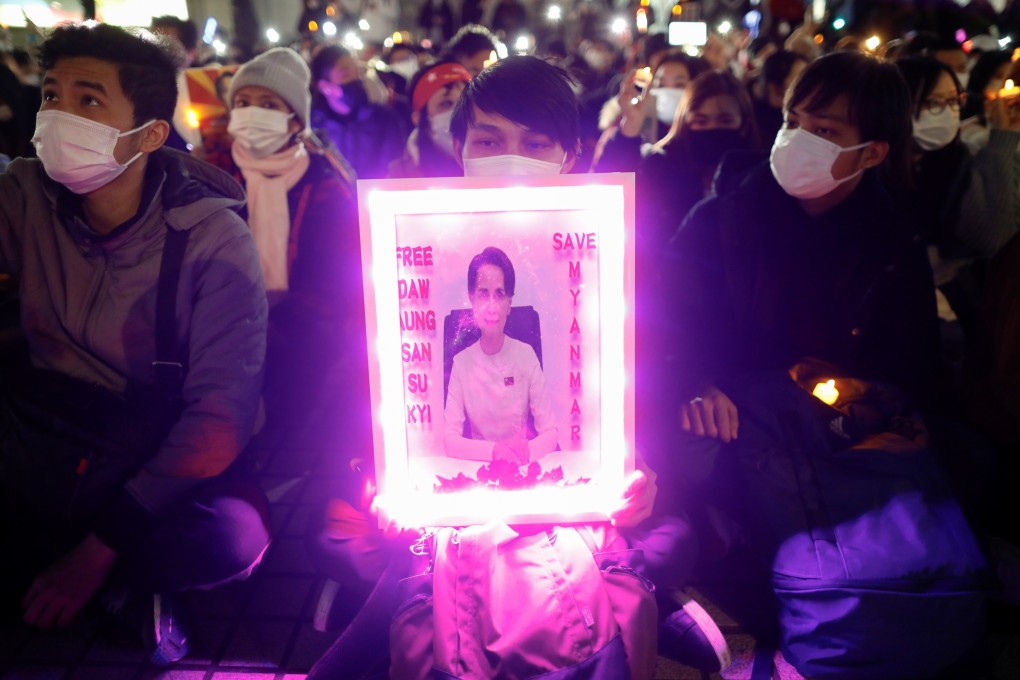 A protester in Tokyo holds a placard demanding the release of elected leader Aung San Suu Kyi during a rally against Myanmar’s military coup on Thursday. Photo: Reuters