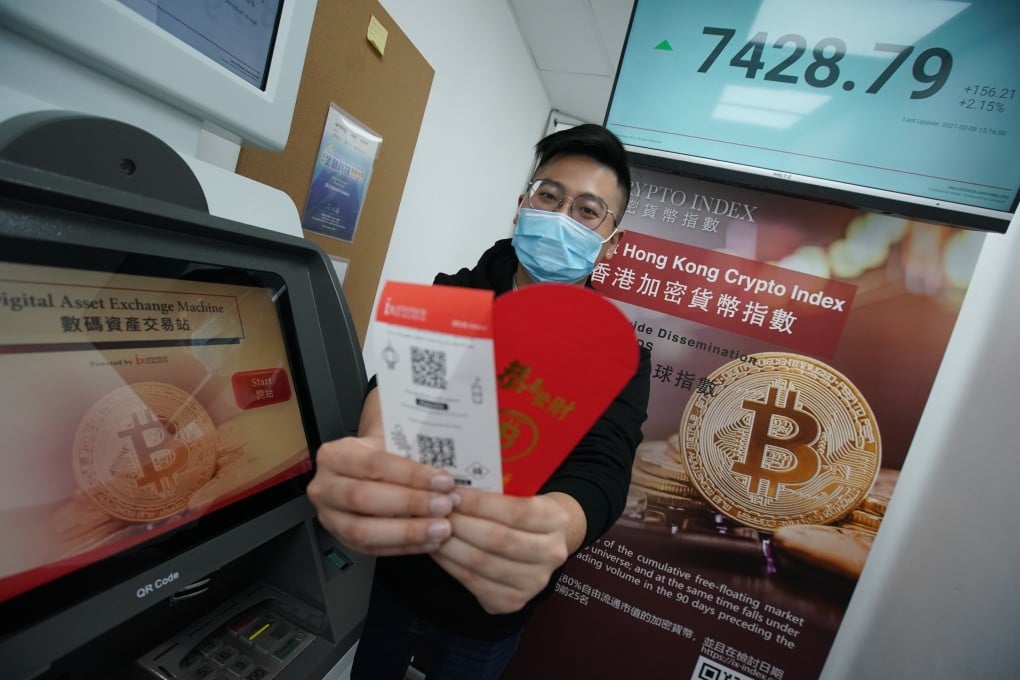Hugo Zheng, manager of ixFintech, demonstrates the paper wallets containing QR codes to buy bitcoin. Photo: Felix Wong