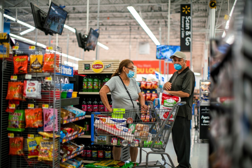 Shoppers stock up on provisions at a Walmart store, in New Jersey, in July 2020. There is a lot of pent-up demand in the household and business sectors which should support spending once infection rates are lower. Photo: Reuters