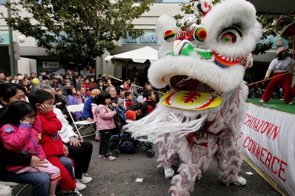 Lion dancers perform in Oakland’s Chinatown. File photo: AP