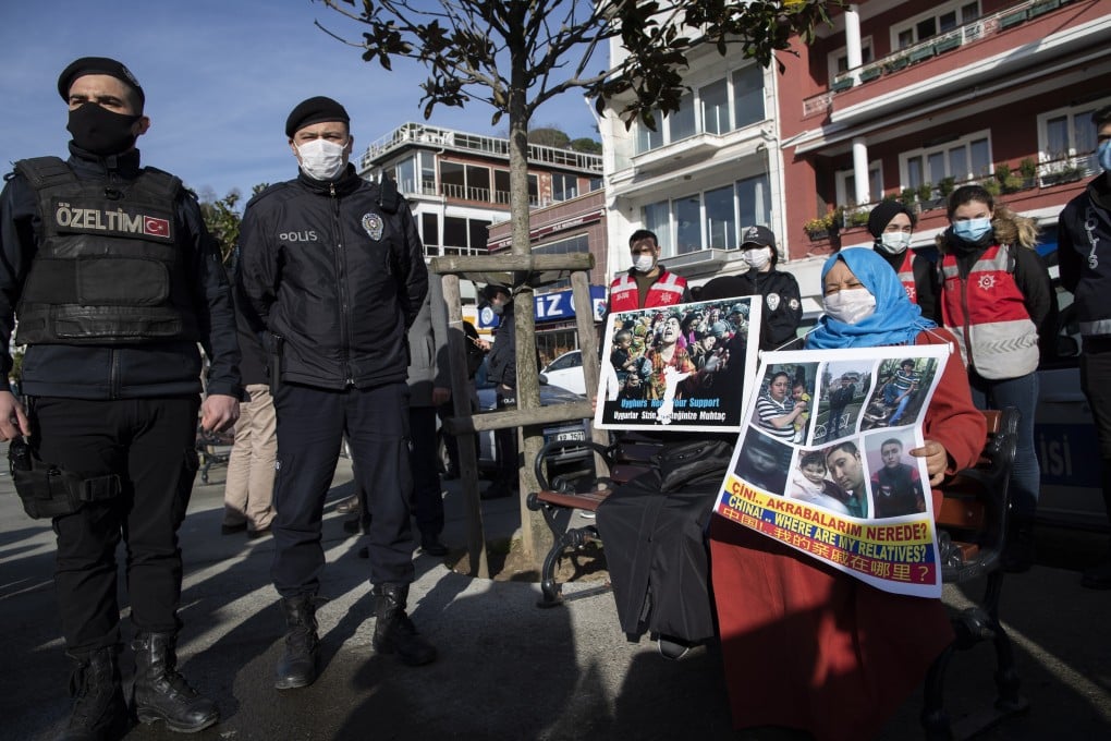 Turkish riot police stand guard as Uygurs protest near the Chinese consulate in Istanbul on Friday. Photo: EPA-EFE